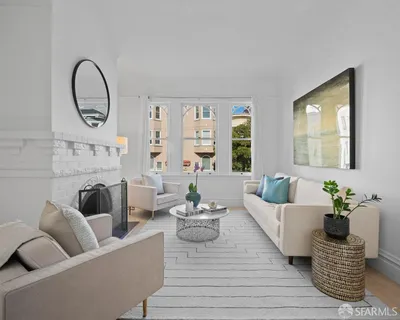 a bedroom with a large bed and a potted plant