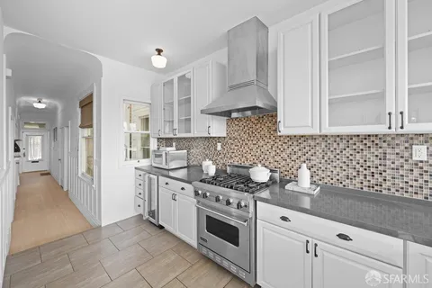 a bathroom with a sink toilet tub and shower