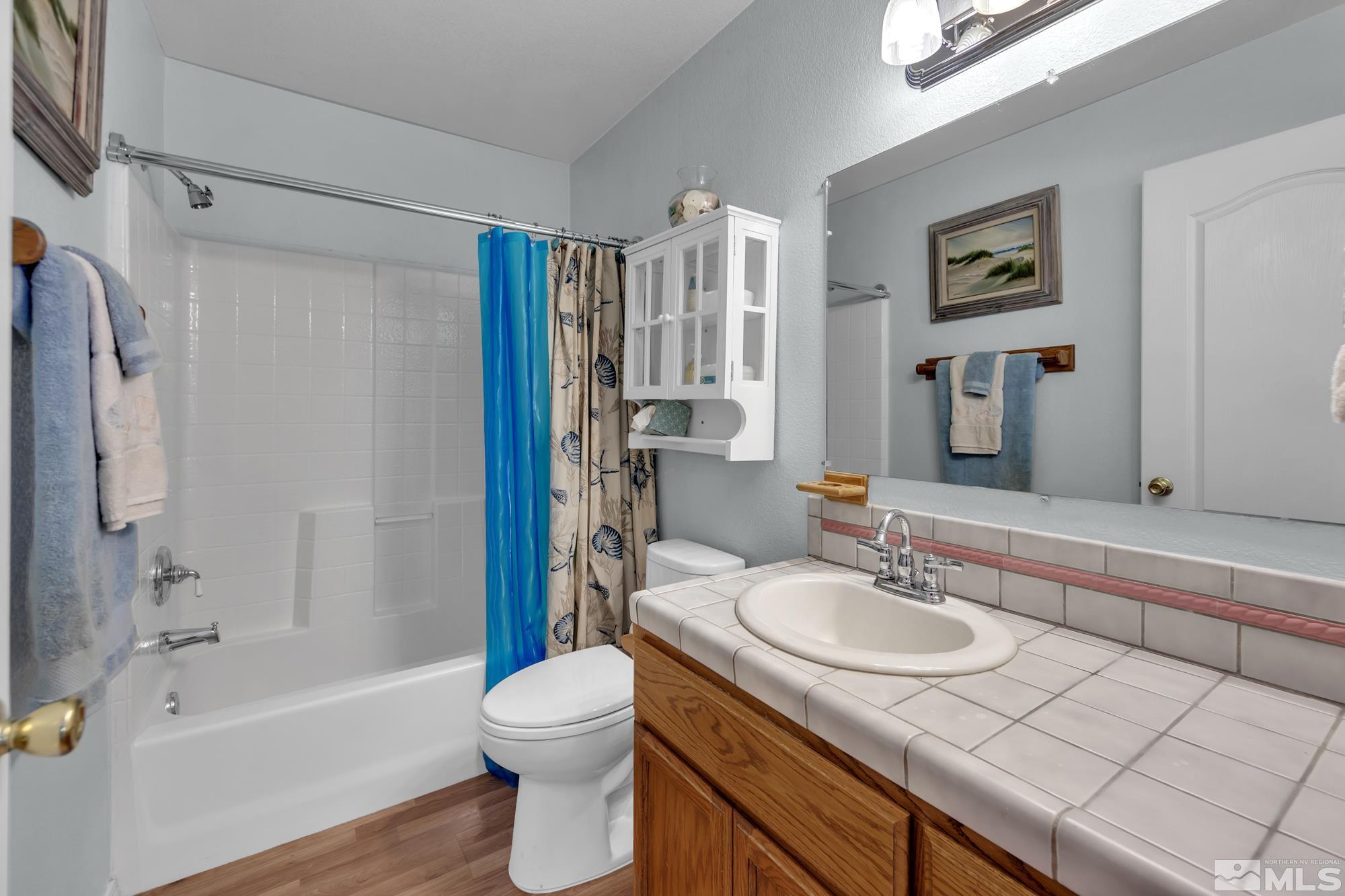1340 Antelope Valley Road Reno, NV 89506 - Photo 24 of 40 a bathroom with a sink toilet and shower