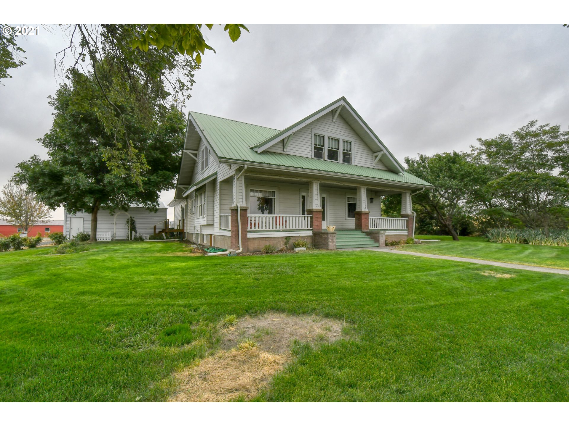 76223 Spring Hollow Road Adams, OR 97810 - Photo 1 of 30 a view of house with a big yard and potted plants