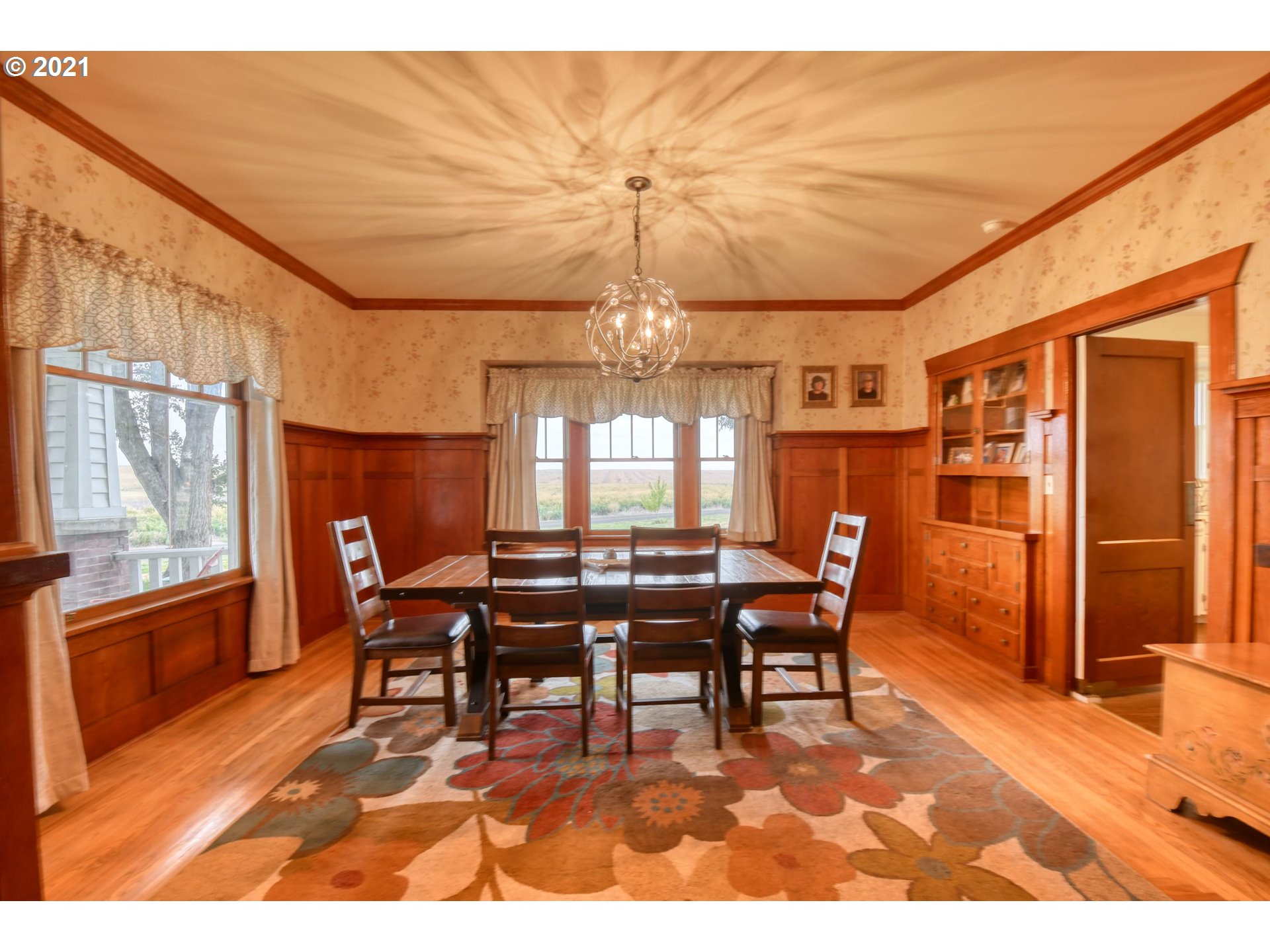 76223 Spring Hollow Road Adams, OR 97810 - Photo 12 of 30 a dining room with furniture a chandelier and wooden floor
