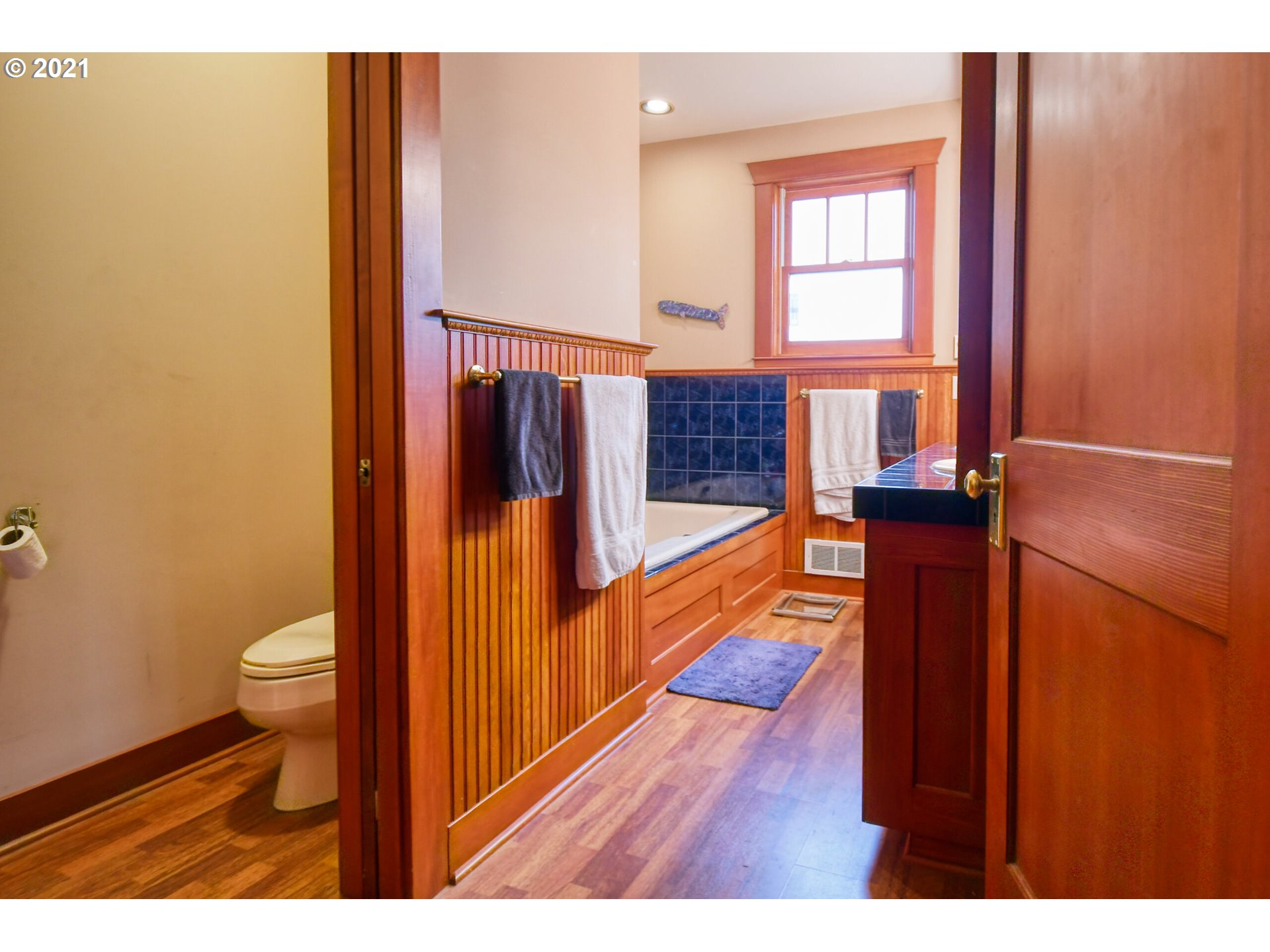 76223 Spring Hollow Road Adams, OR 97810 - Photo 19 of 30 a view of a hallway with wooden floor and staircase