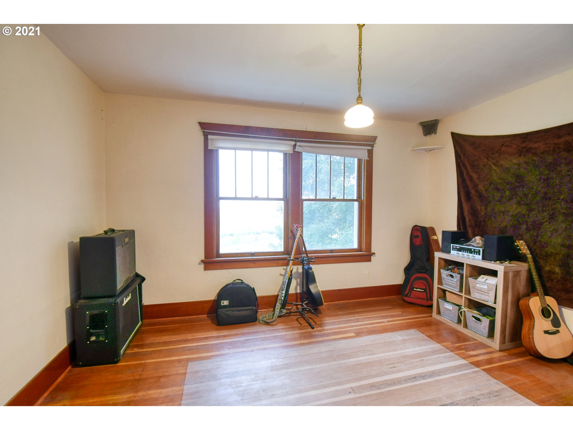 76223 Spring Hollow Road Adams, OR 97810 - Photo 25 of 30 a living room with furniture a flat screen tv and a window