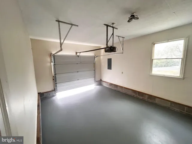 a view of a room with window and wooden floor