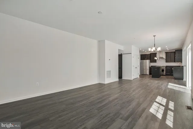 a view of a kitchen with a sink and a stove top oven