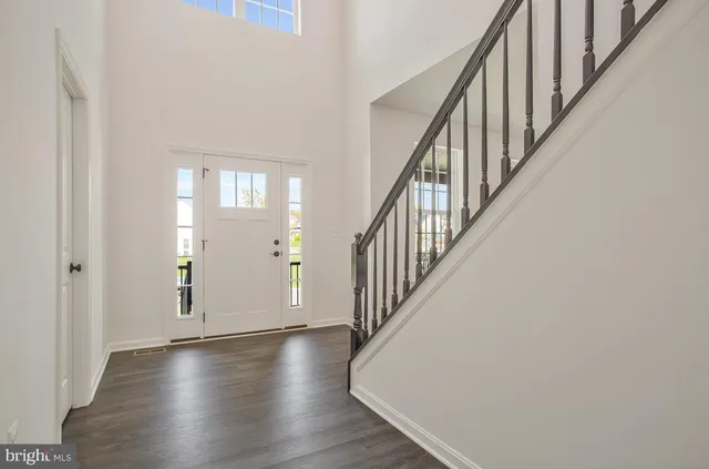 a view of an entryway with wooden floor