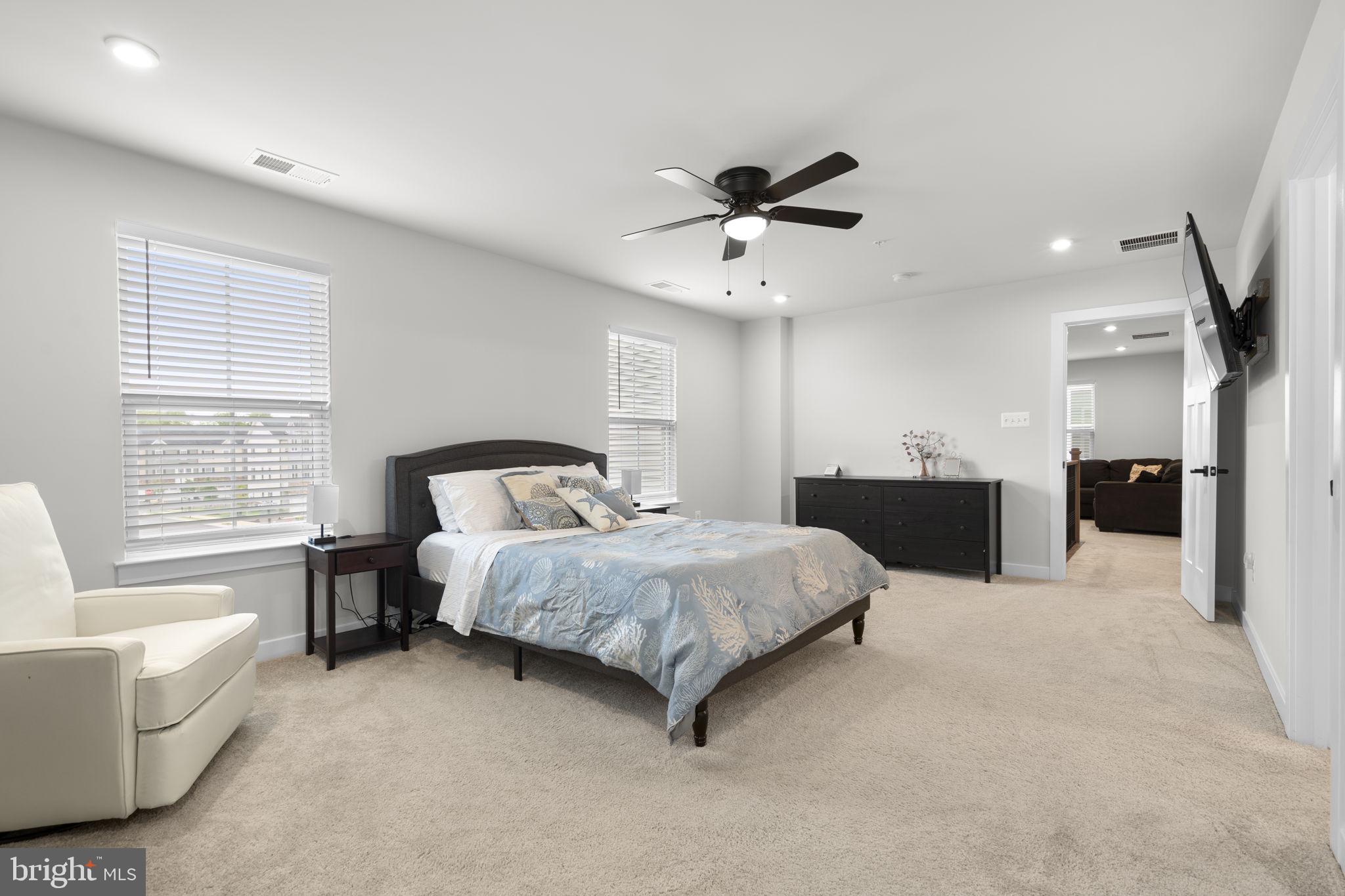 1713 Aurora Way Frederick, MD 21702 - Photo 28 of 57 a spacious bedroom with a bed couch and window