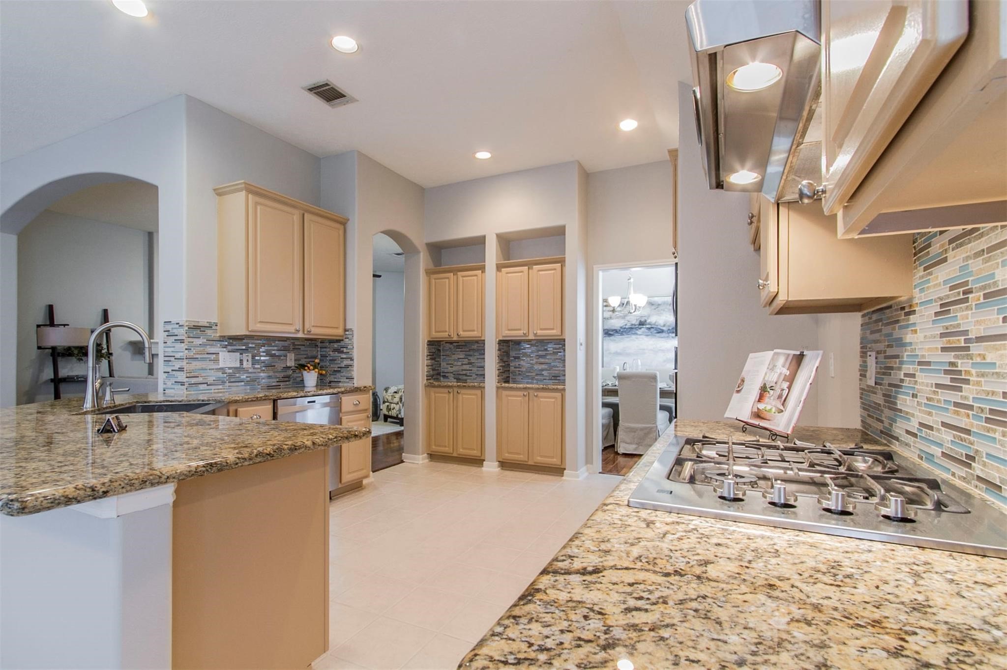 1230 Sienna Hill Drive Houston, TX 77077 - Photo 12 of 42 a large bedroom with a large bed and a view of living room