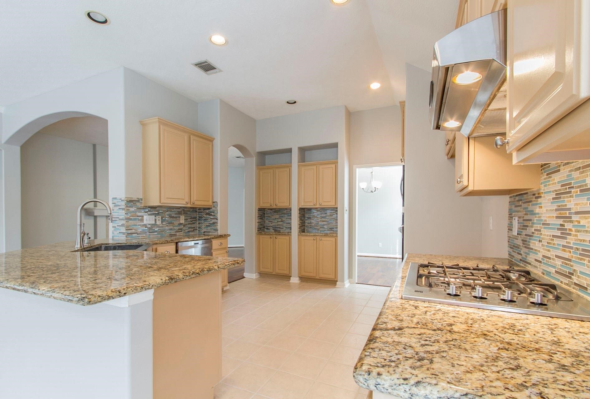 1230 Sienna Hill Drive Houston, TX 77077 - Photo 13 of 42 a bathroom with a granite countertop sink and a mirror