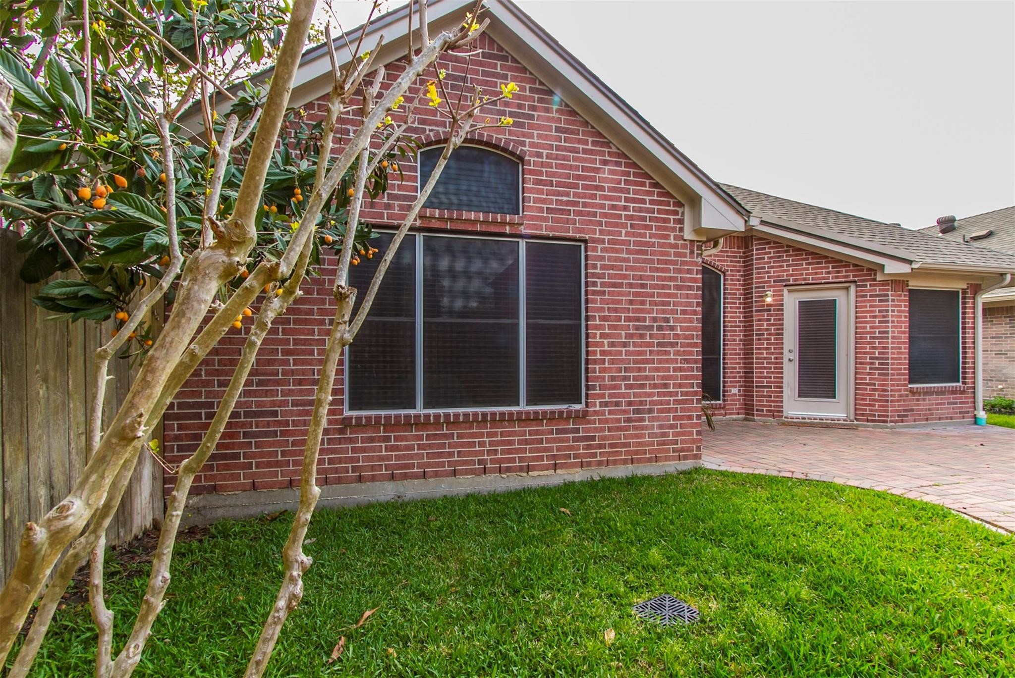 1230 Sienna Hill Drive Houston, TX 77077 - Photo 37 of 42 a front view of a house with a garden