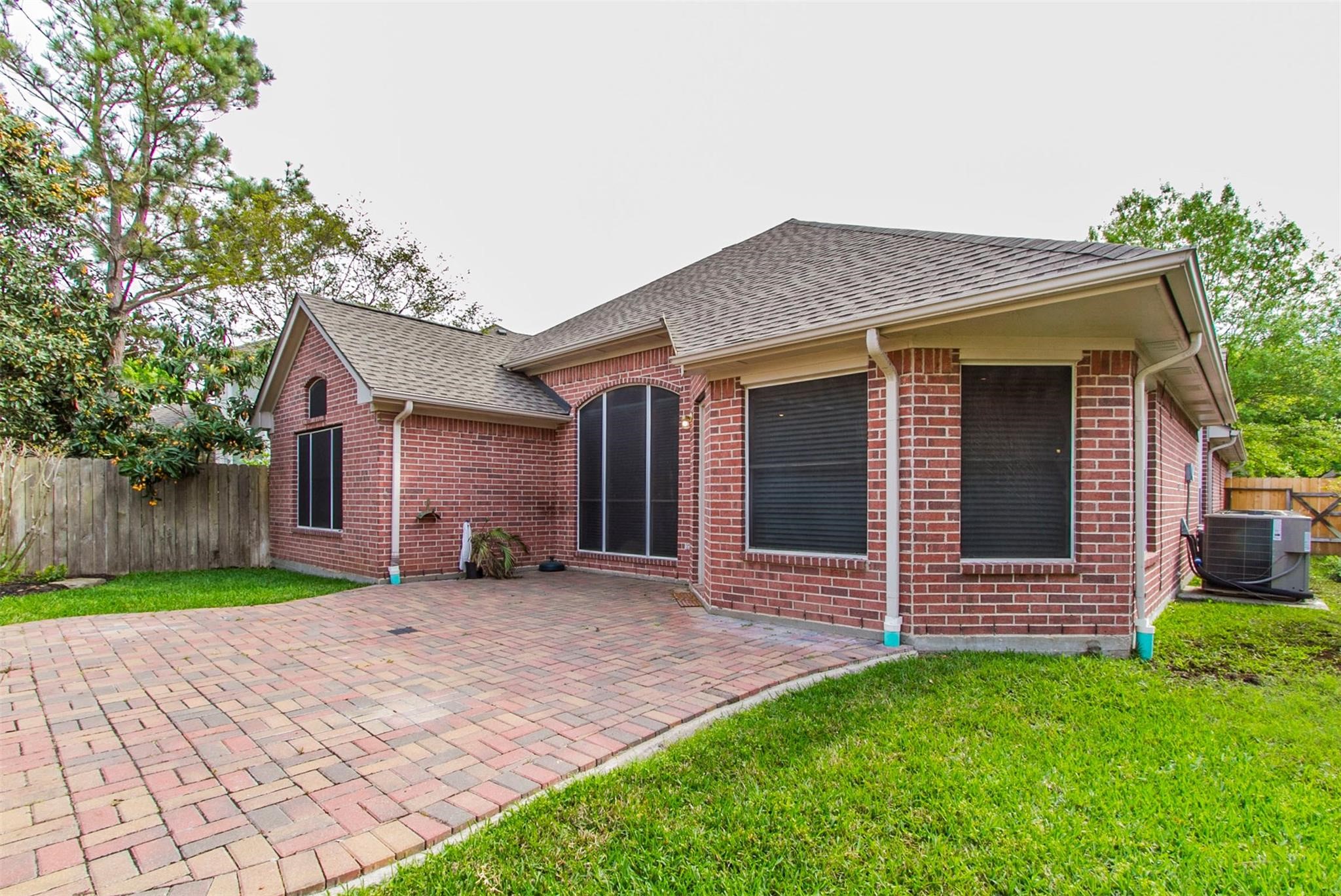 1230 Sienna Hill Drive Houston, TX 77077 - Photo 38 of 42 a front view of a house with a yard and garage