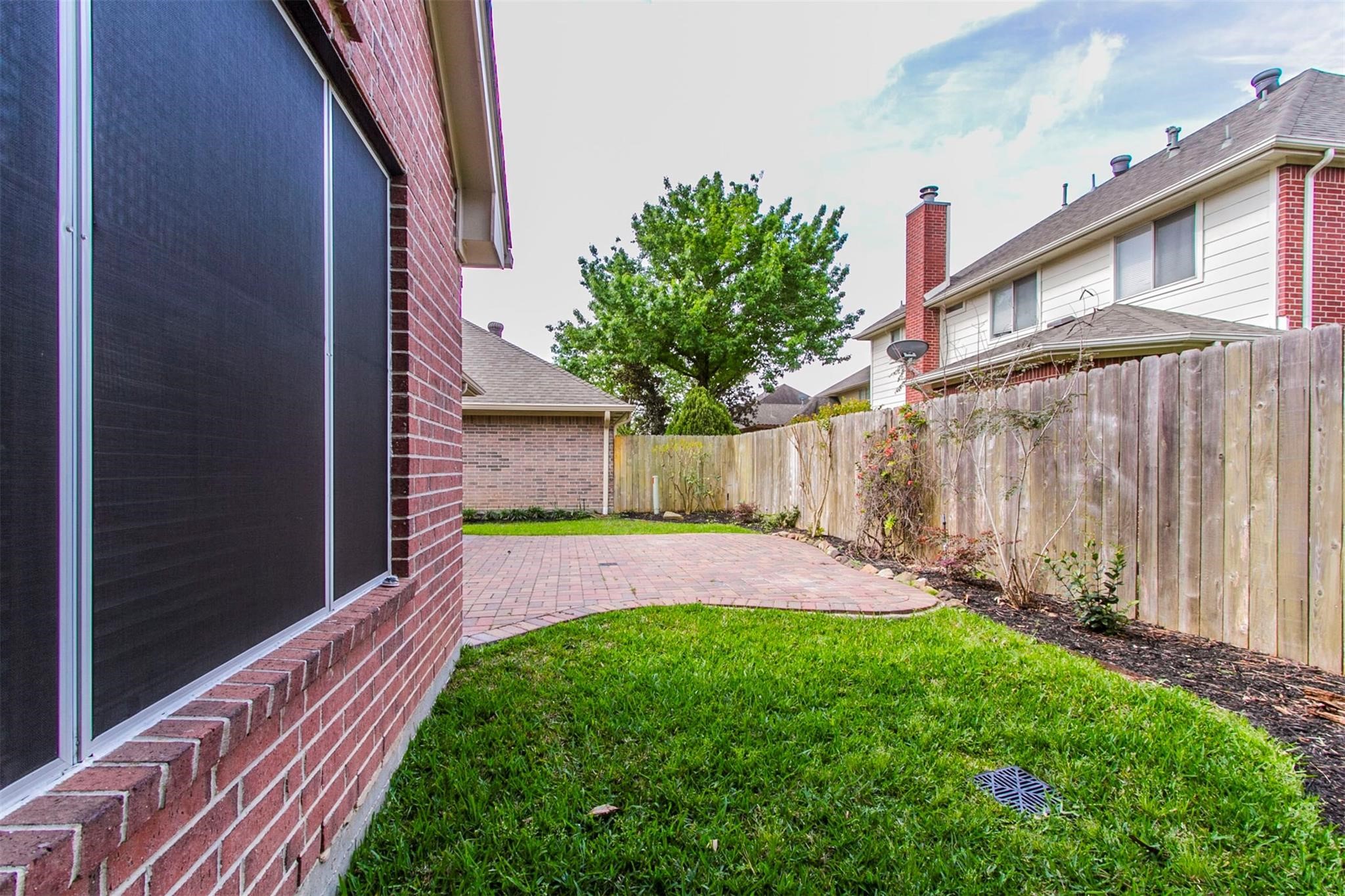 1230 Sienna Hill Drive Houston, TX 77077 - Photo 39 of 42 a view of back yard of the house with an outdoor space