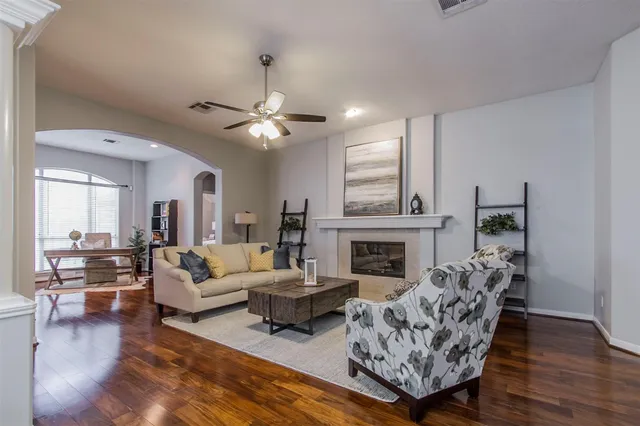 a living room with furniture and a fireplace
