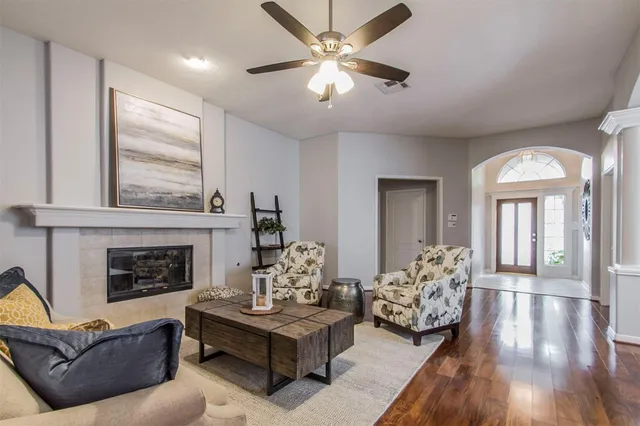 a living room with furniture and a fireplace
