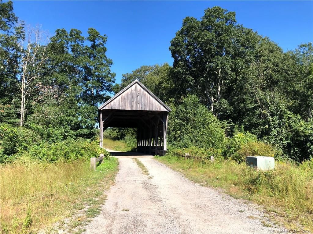 Drive over covered bridge to your property