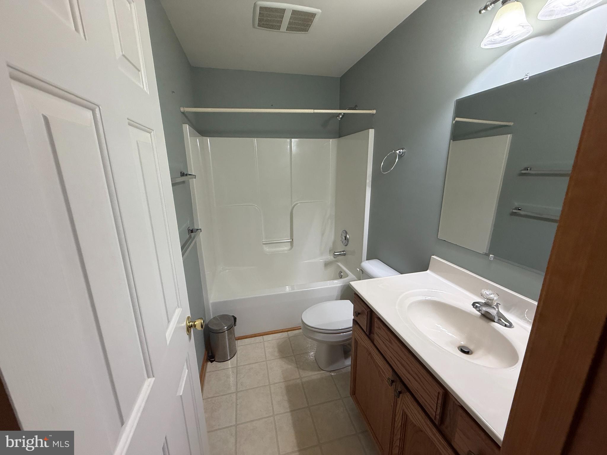 1622 Forrest Avenue Dover, DE 19904 - Photo 11 of 12 a bathroom with a sink a toilet and shower