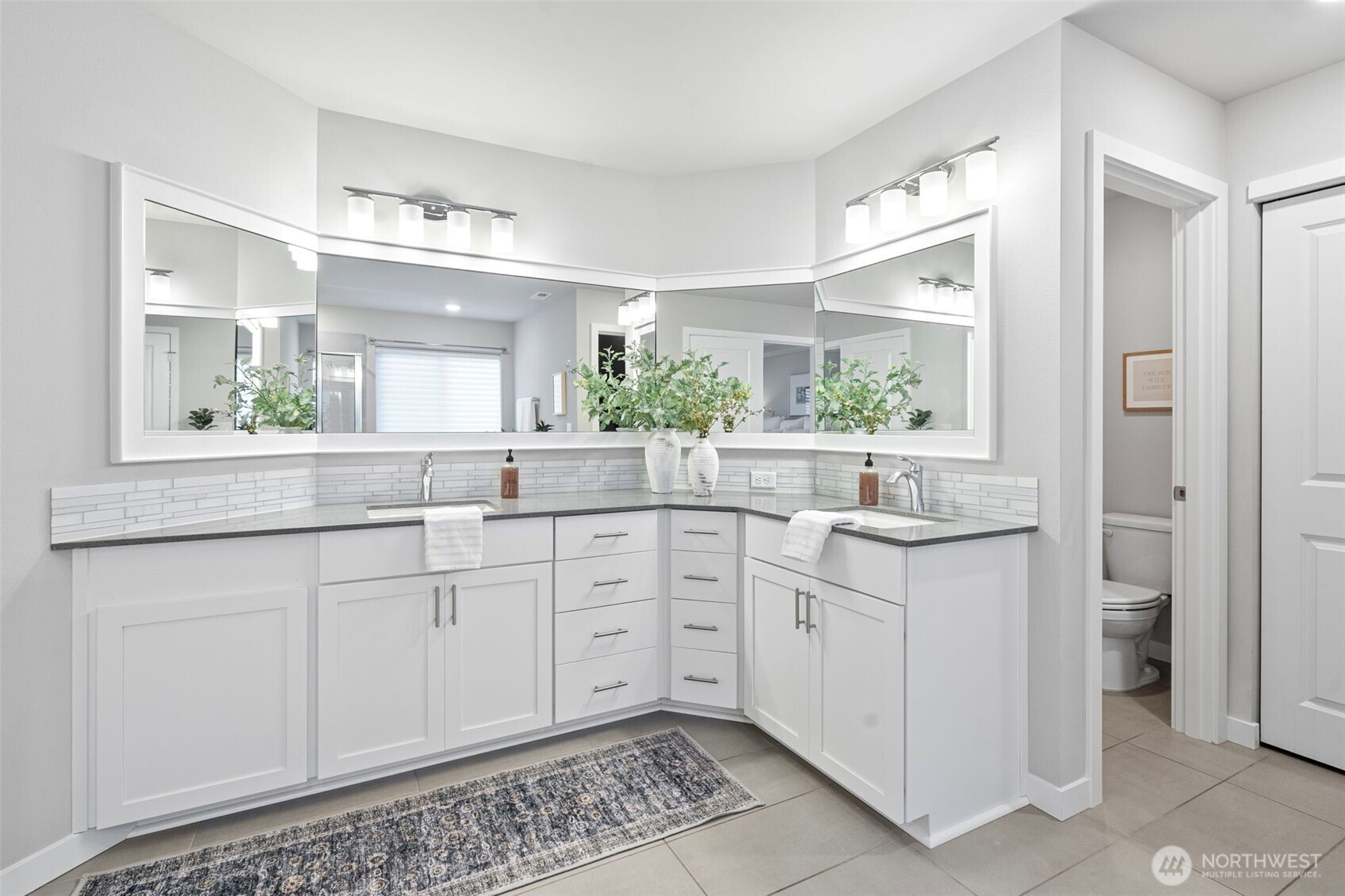 4526 Olympus Loop Gig Harbor, WA 98332 - Photo 20 of 38 a spacious bathroom with a granite countertop sink and a mirror