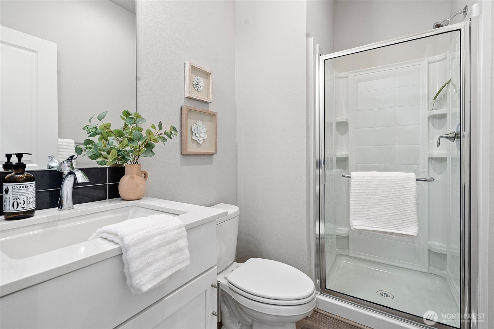 4526 Olympus Loop Gig Harbor, WA 98332 - Photo 6 of 38 a bathroom with a sink a toilet and shower