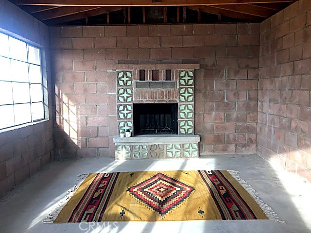 51050 Cholla Road Johnson Valley, CA 92285 - Photo 4 of 11 a view of an empty room and fire place
