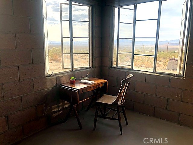 51050 Cholla Road Johnson Valley, CA 92285 - Photo 6 of 11 a dining room with furniture and window