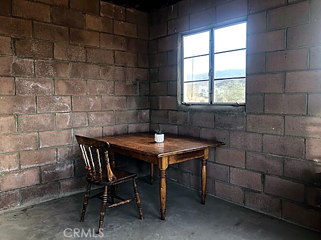 51050 Cholla Road Johnson Valley, CA 92285 - Photo 7 of 11 a room with a table and a window