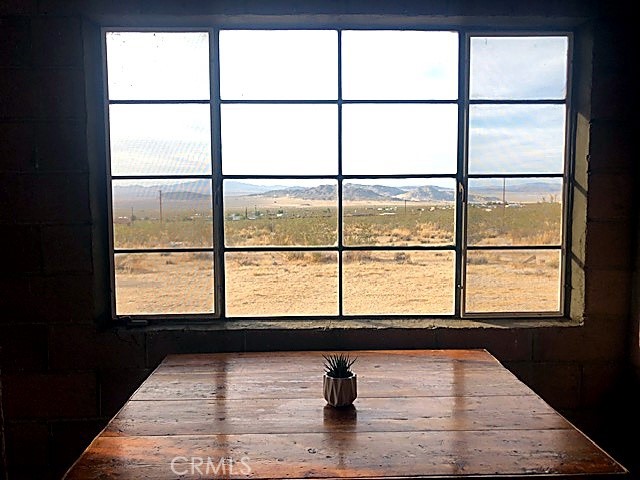 51050 Cholla Road Johnson Valley, CA 92285 - Photo 10 of 11 a view of wooden floor and a window