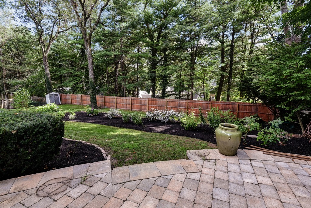 75 Clarke Road Needham, MA 02492 - Photo 17 of 19 a view of a backyard with potted plants and large trees