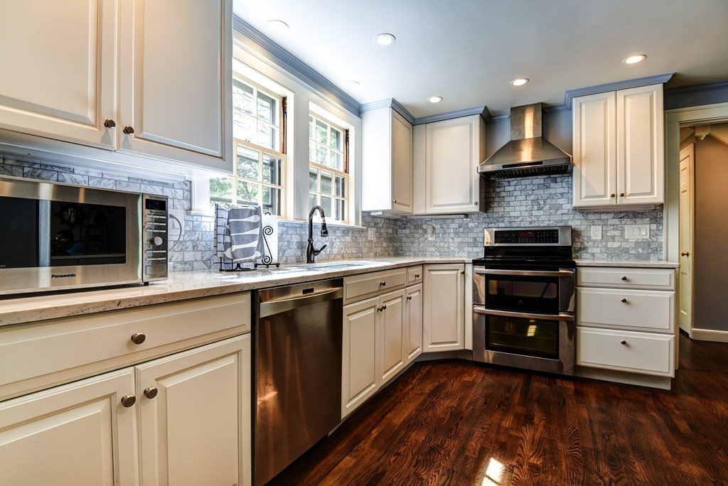 75 Clarke Road Needham, MA 02492 - Photo 3 of 19 a kitchen with granite countertop cabinets appliances and a window