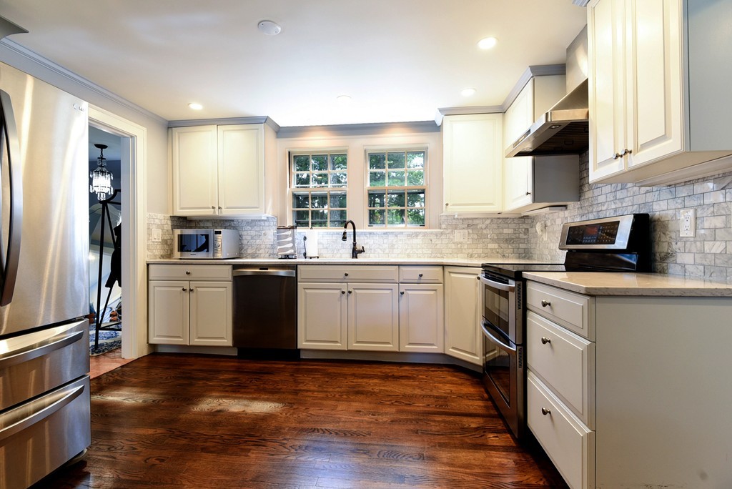 75 Clarke Road Needham, MA 02492 - Photo 4 of 19 a kitchen with a sink cabinets stainless steel appliances and a window