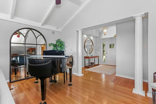 a living room with furniture a rug and a window