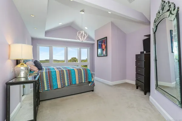 a bedroom with furniture and a window