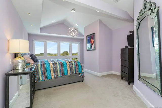 a bedroom with furniture and a window