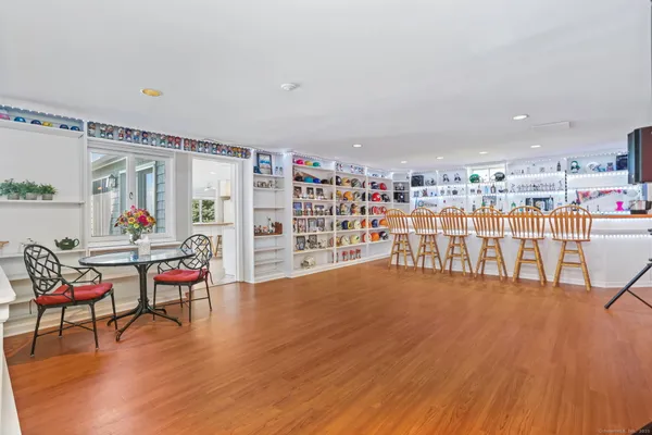 a living room with lots of furniture and a wooden floors