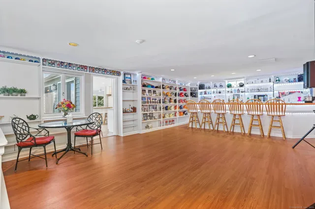 a living room with lots of furniture and a wooden floors