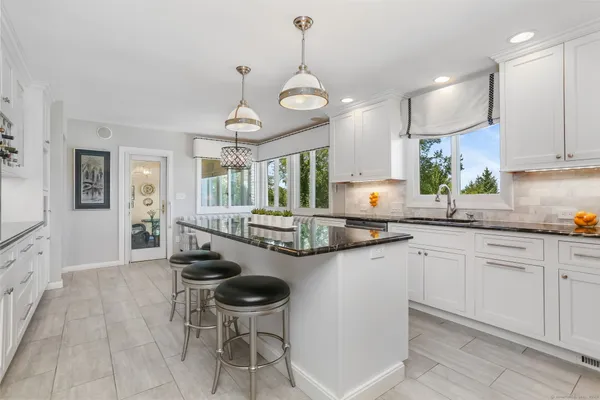 a kitchen with sink cabinets and window