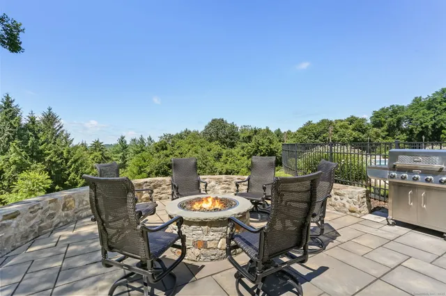 a view of a table and chairs in the patio