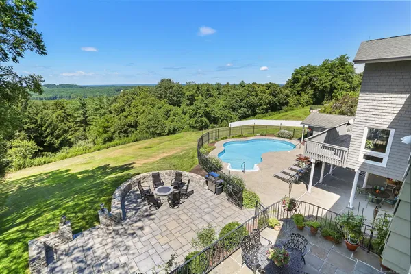 a view of a swimming pool with a patio
