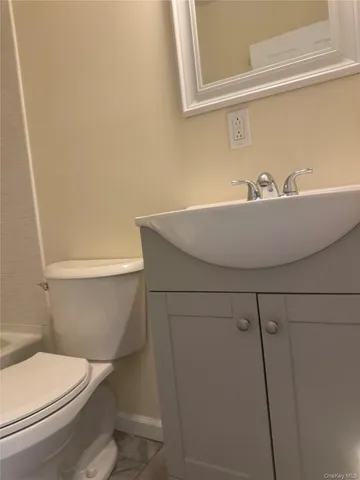 a bathroom with a sink and toilet