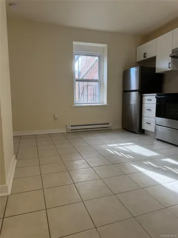 en empty room with a fireplace