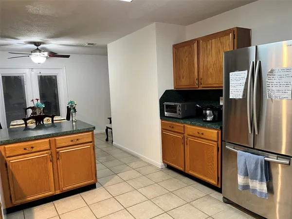 a kitchen with granite countertop cabinets and stainless steel appliances