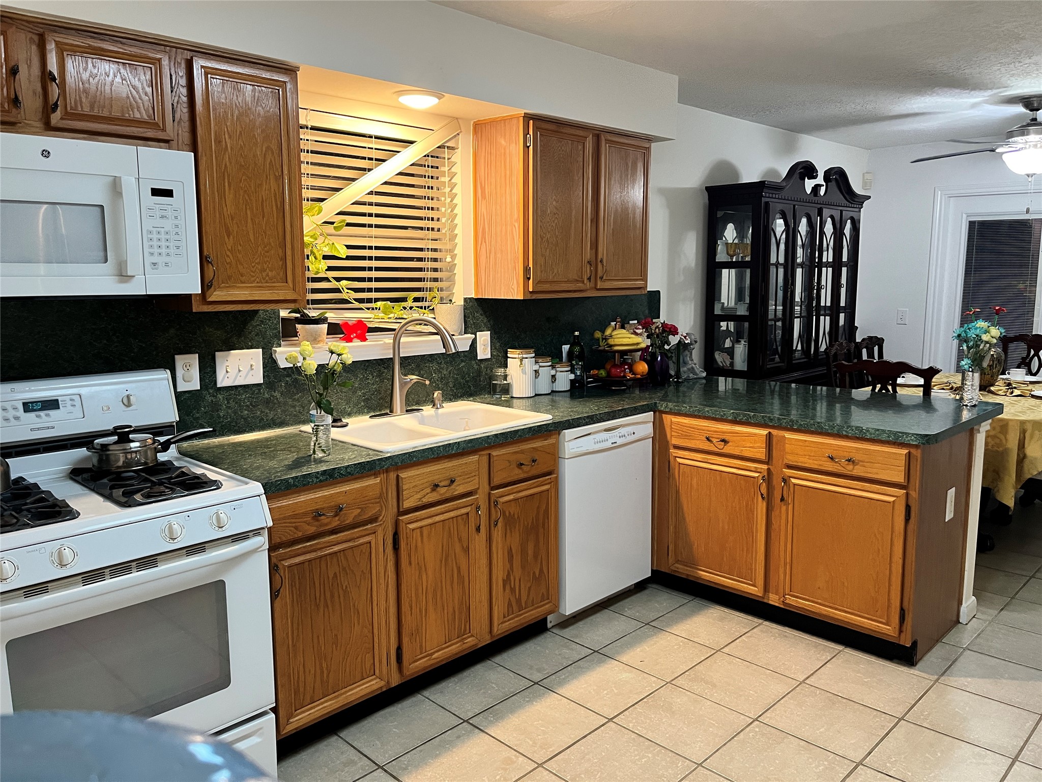 28723 Sedgefield Street Spring, TX 77386 - Photo 12 of 33 a kitchen with stainless steel appliances a sink stove and cabinets