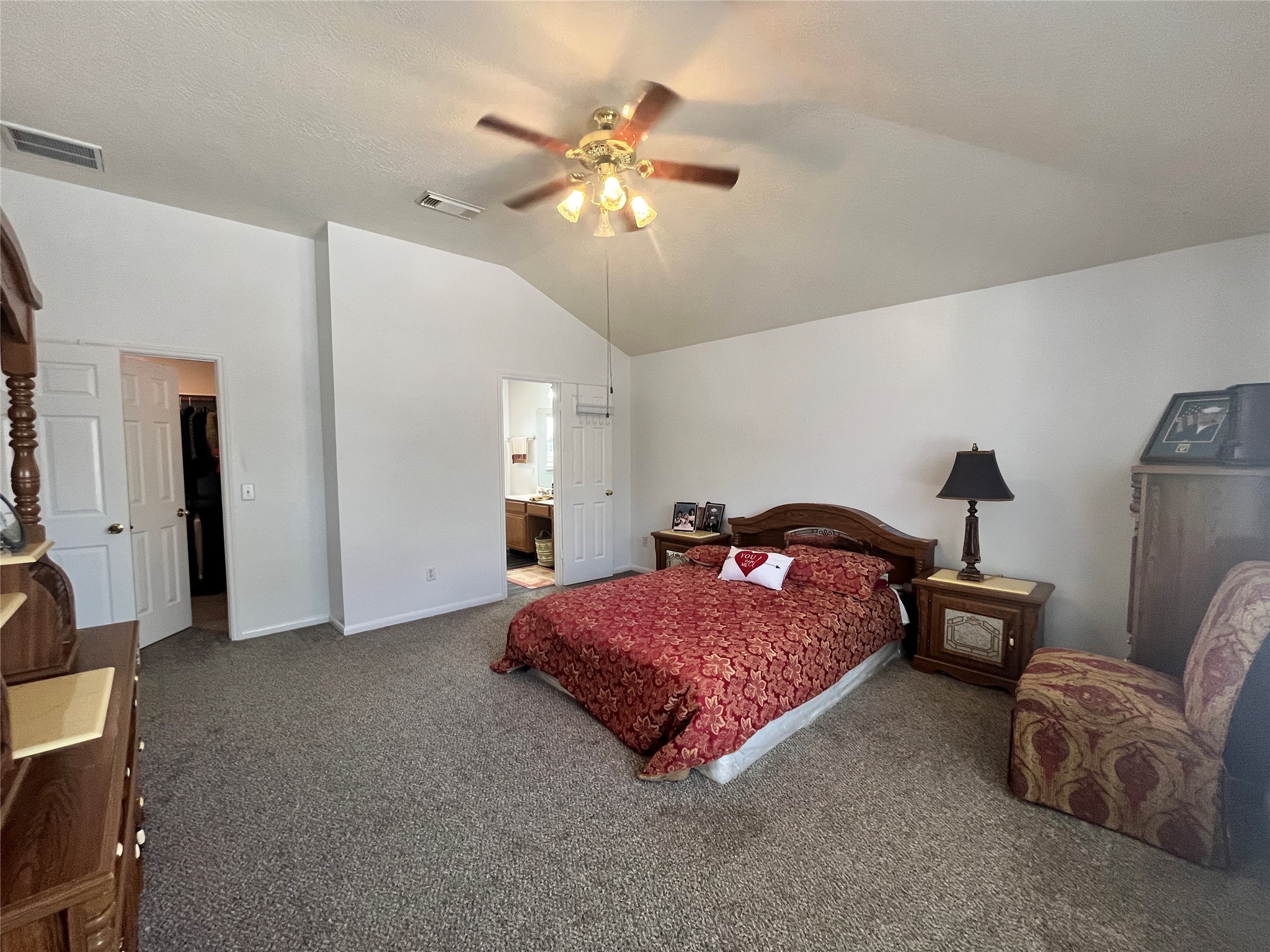 28723 Sedgefield Street Spring, TX 77386 - Photo 31 of 33 a bedroom with a bed and a chandelier