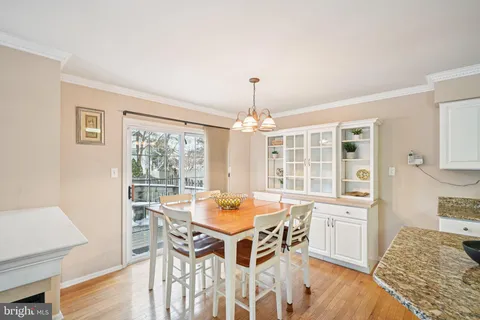 a dining room with a table and chairs