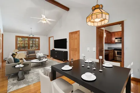 a kitchen with granite countertop a sink a stove and cabinets