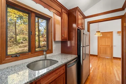 a bedroom with a bed and a table