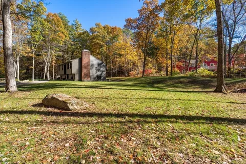 a view of a backyard of the house