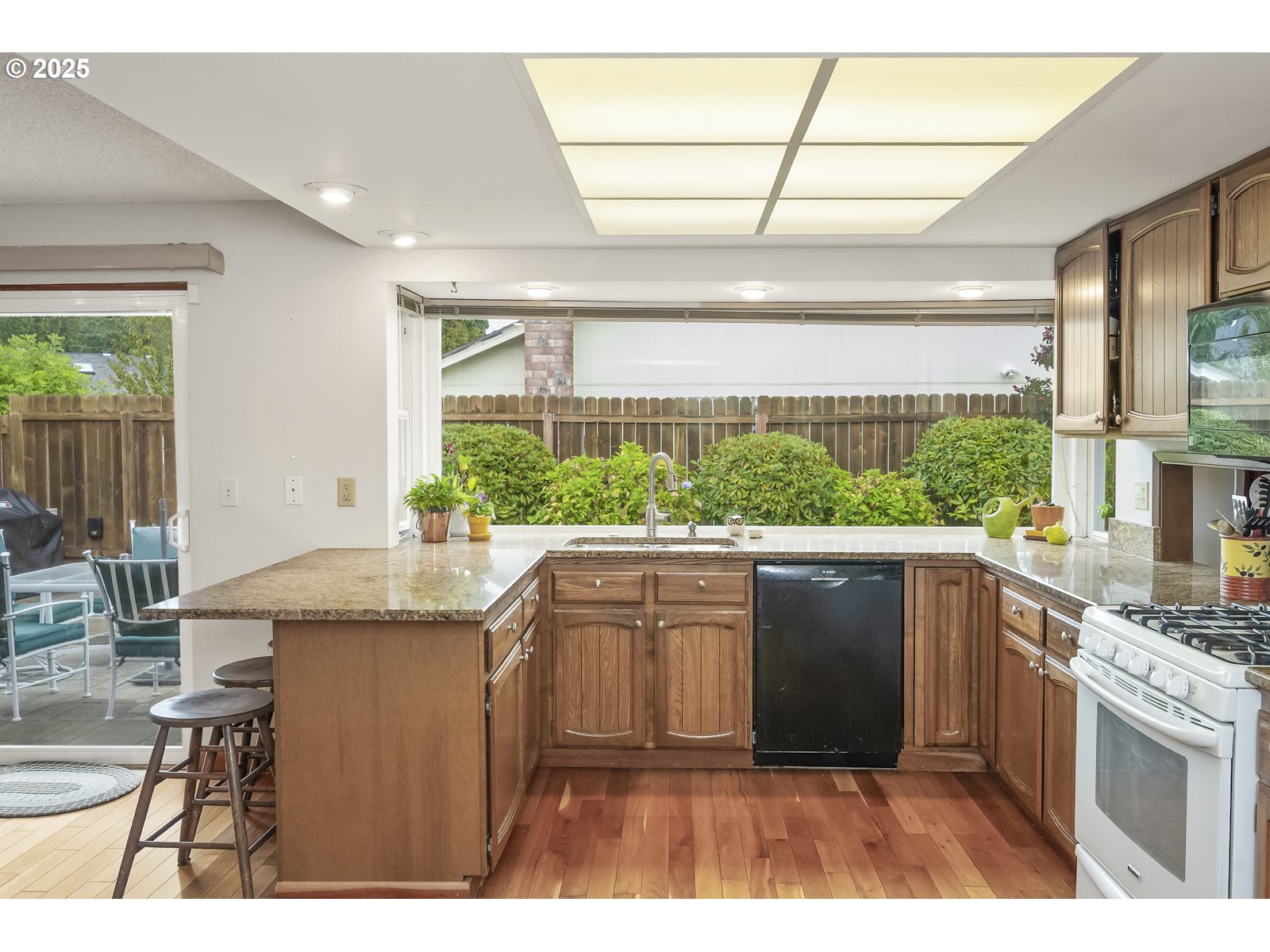 490 Southwest Nancy Avenue Gresham, OR 97030 - Photo 14 of 37 a kitchen with a sink and cabinets