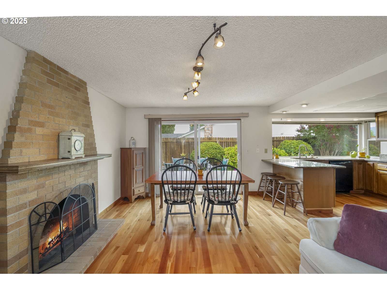 490 Southwest Nancy Avenue Gresham, OR 97030 - Photo 18 of 37 a living room with furniture a fireplace and a floor to ceiling window