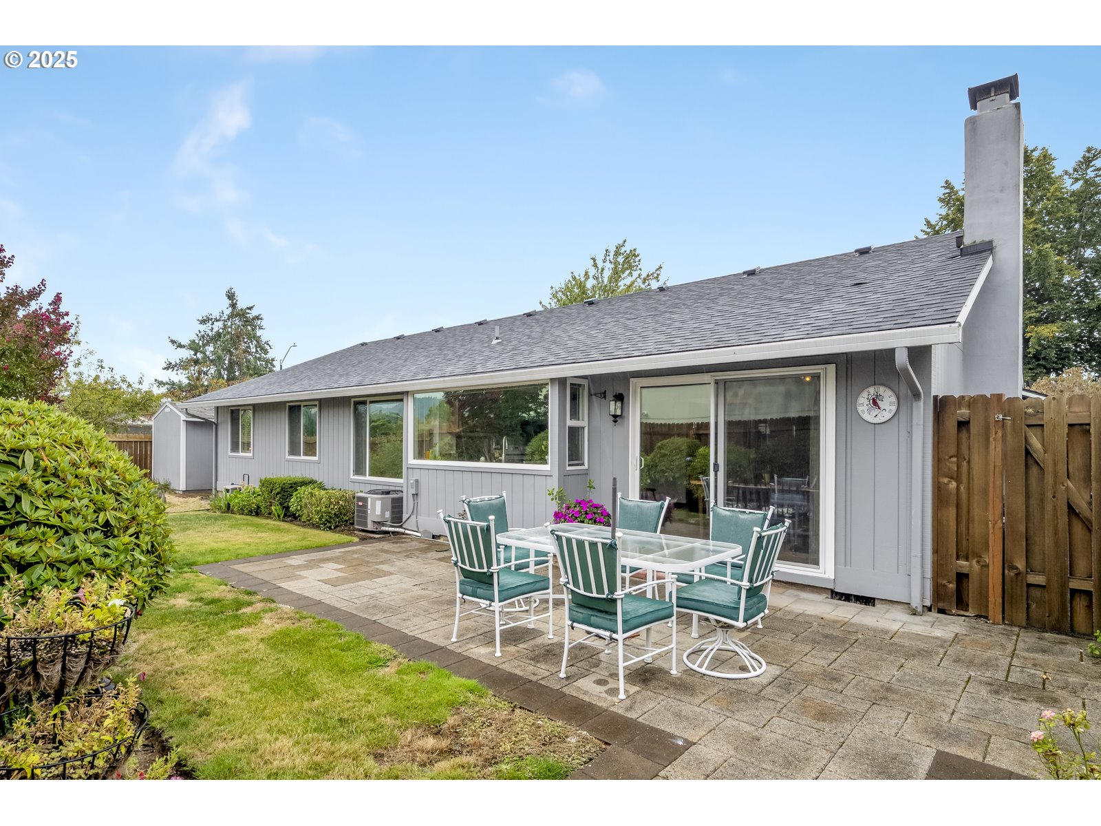 490 Southwest Nancy Avenue Gresham, OR 97030 - Photo 19 of 37 a view of a house with backyard sitting area and garden