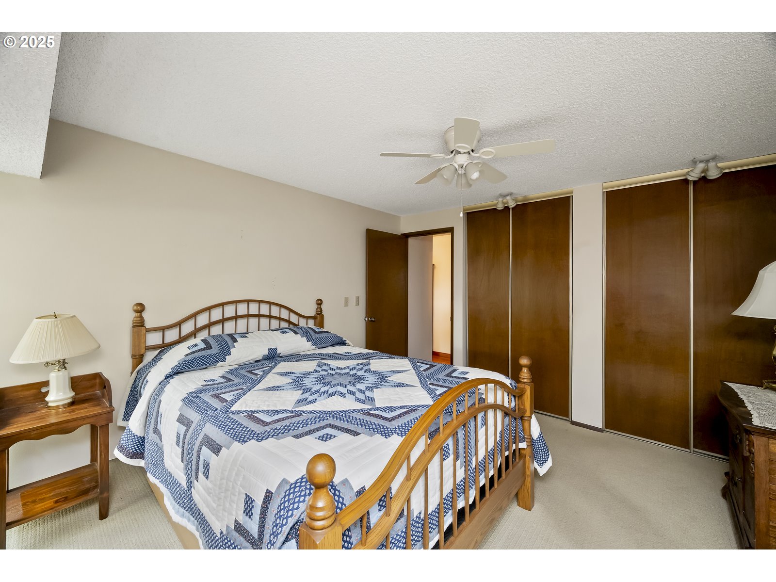 490 Southwest Nancy Avenue Gresham, OR 97030 - Photo 22 of 37 a bedroom with a bed and a chandelier
